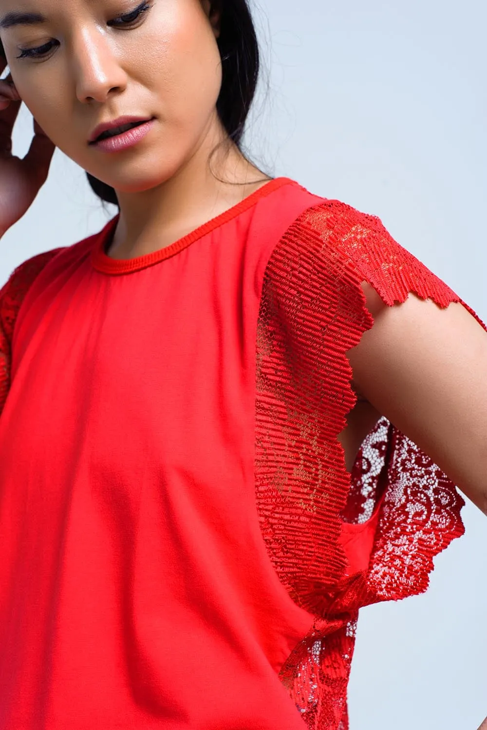 Red top with lace back and ruffles