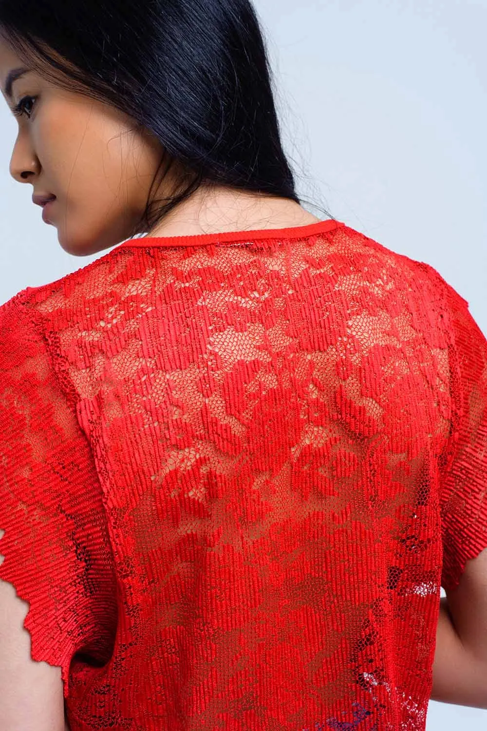 Red top with lace back and ruffles